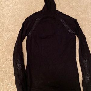 black turtleneck with sheer detailing